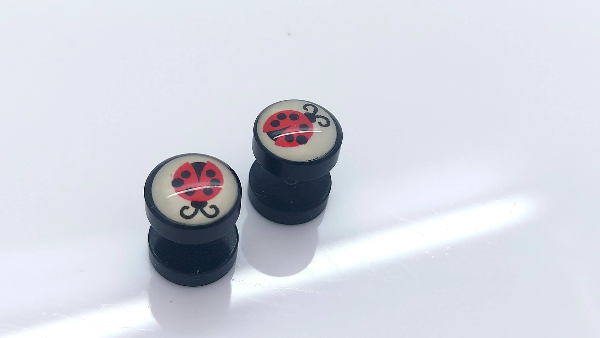 PAIR OF 9MM BLACK UNISEX FAKE EAR PLUGS STAINLESS STEEL LOGO STUD BODY PIERCING steelstyle33